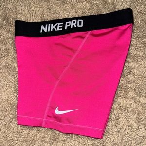 Pink with black waistband Nike pros. Good condition. Old style.